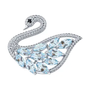 Брошь из серебра с топазами и фианитами